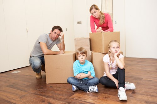Careful boxing and labeling of household items for packing services in Northharrow