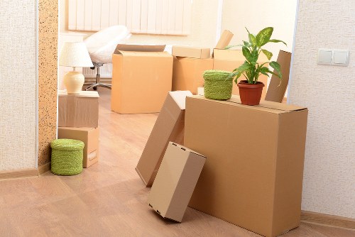 Professional movers handling boxes and furniture in Northharrow
